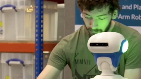 Student working with a robot