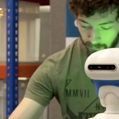 Student working with a robot